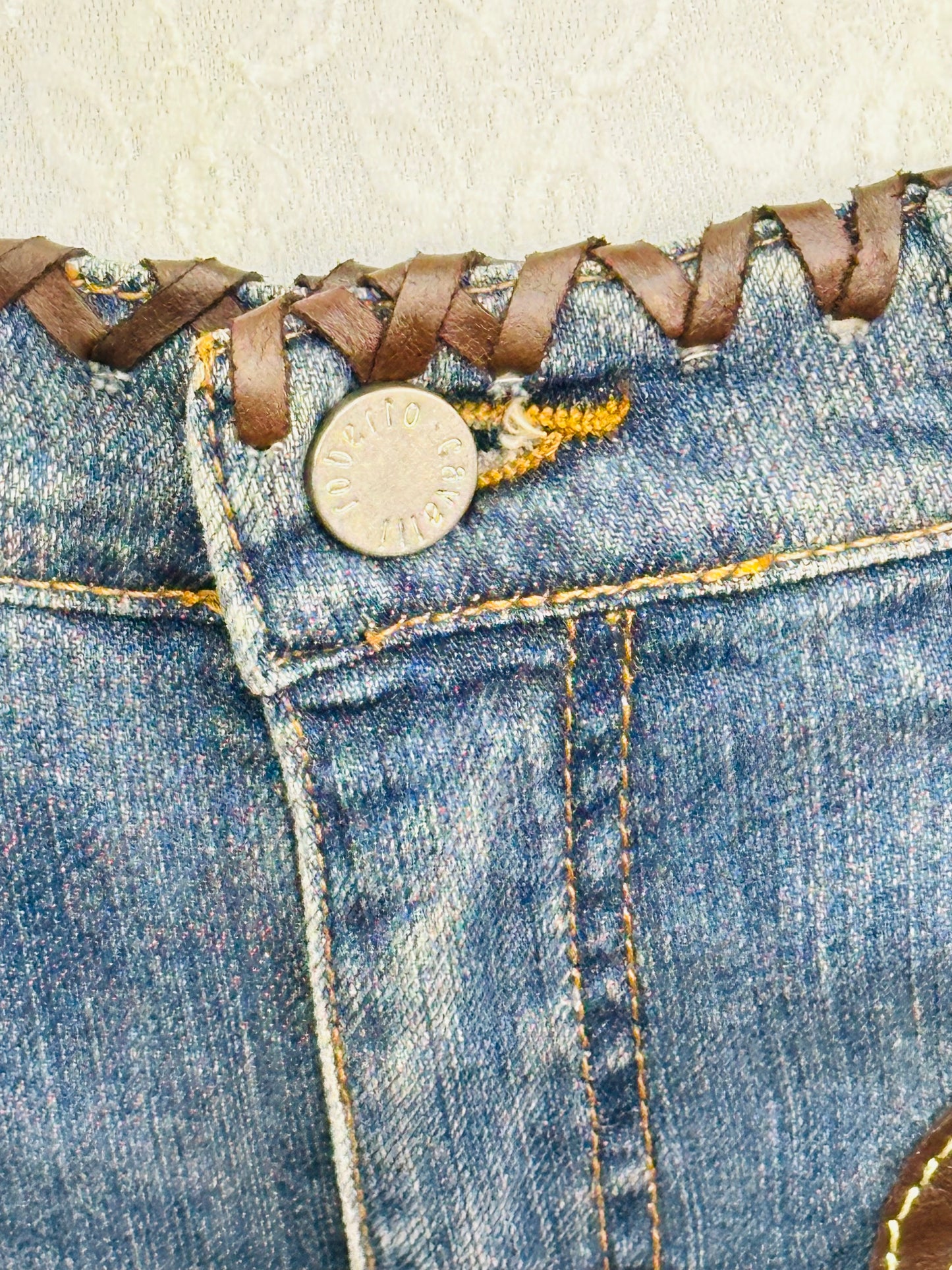￼ROBERTO CAVALLI - Jeans Western Revival in Denim e Pelle con Frange