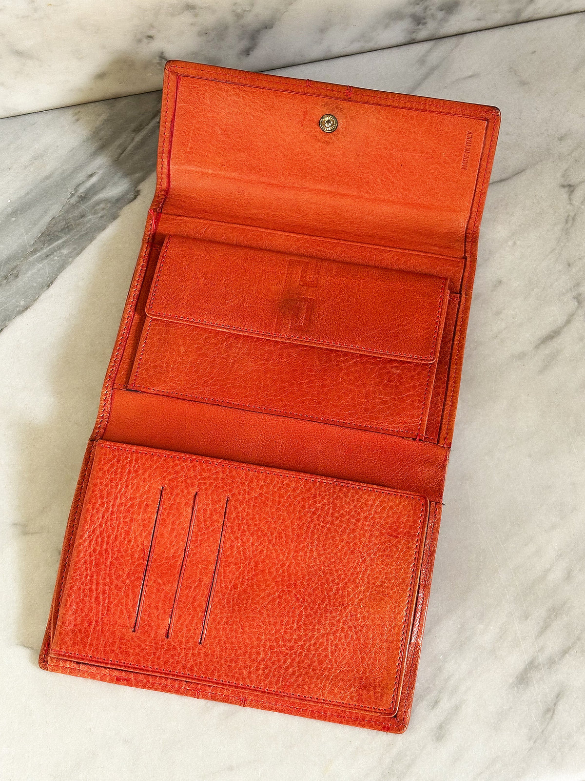 GIANNI VERSACE – Portafoglio in pelle arancio con motivo Greca vintage anni 90’
